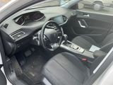 the interior of a car with a steering wheel and dashboard