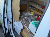 a white van with a bunch of items inside of it