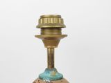 a small vase with a gold base and a blue top