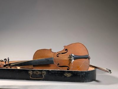 a violin and a violin case sitting on a table