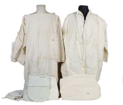 several pieces of clothing are displayed on a mannequin stand