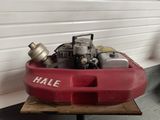 a small red boat with a gas can in it