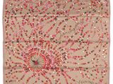 a beige scarf with pink and red flowers on it