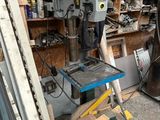 a machine that is sitting on a table in a garage