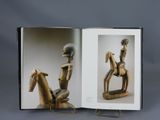 an open book with a picture of a man riding a horse