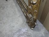 a mirror that is sitting on the floor next to a box