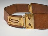 brown leather belt with gold buckle and hearts on it