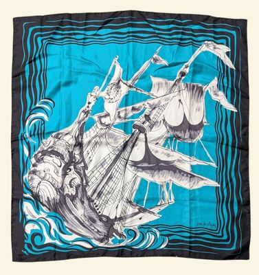 a blue and black banda with an image of a ship on it