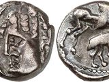 une pièce d'argent sur laquelle figurent un cheval et un oiseau