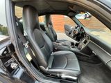 the interior of a car with black leather seats and a steering wheel