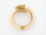 an image of a gold ring with a leopard head on it