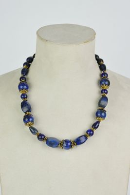 a close up of a necklace on a mannequin mannequin