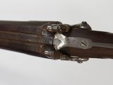 a close up of a gun that is on display