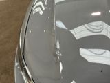 a close up of a car ' s hood with the number five on it