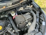 the engine of a car with its hood open and the hood up