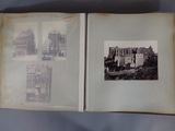 an old book opened to show a picture of a castle
