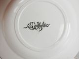 a white plate with a black writing on it