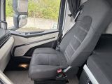 a seat in the back of a van with a black seat belt