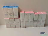 several boxes of skin care products are stacked on top of each other