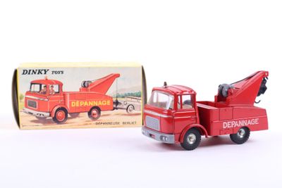 a red toy truck with a crane on the back