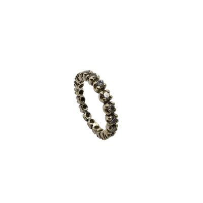 a close up of a silver ring on a white background