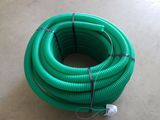 a close up of a green hose sitting on top of a floor