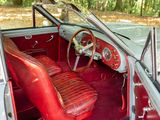a red leather seat in the front of a red car