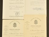 three papers with signatures on them sitting on top of a table