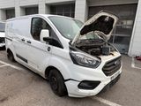 a white van with the hood open in a parking lot