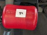 a close up of a pair of red dumbs on a gym machine