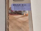 a box of wooden flooring on a white surface
