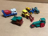 a lot of toy trucks that are sitting on a table