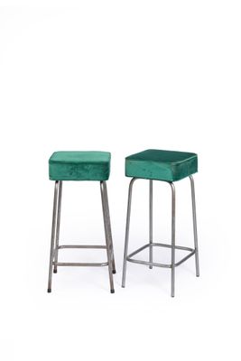 pair of green velvet stools with chrome legs