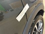 a sticker on the side of a car that says sorry