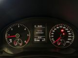 a close up of a car dashboard with various gauges