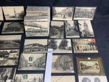 a lot of old postcards that are on the table