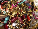a pile of assorted jewelry on a table