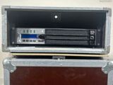 a large metal case with a cd player inside of it