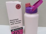 pink and white water bottle next to a box on a table
