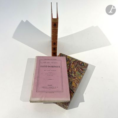 two books sitting on top of each other on a table