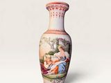 a vase with a painting on it sitting on a table