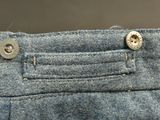 a close up of a pair of jeans with buttons on them