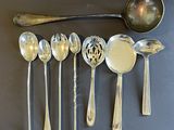 a lot of spoons and spoon spoons on the table