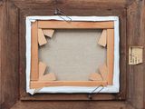 a close up of a picture frame with a piece of paper taped to it
