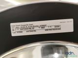 a close up of a metal bowl with a label on it