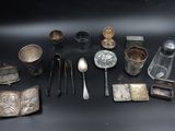 a lot of silver objects on a black surface