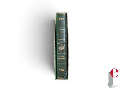 an image of a book with a green cover sitting on top of a white surface