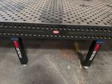 an image of a metal table with holes on it