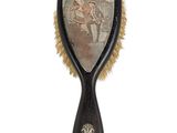 a black brush with a picture of a man on it