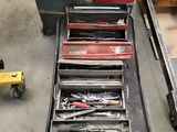 many tools that are sitting on a table in the garage